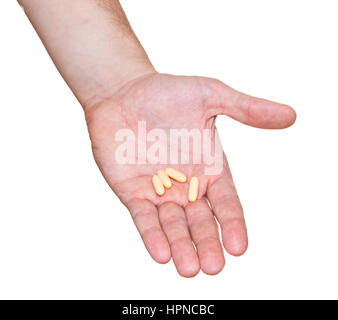 Pillen auf Hand isoliert auf weißem Hintergrund Stockfoto