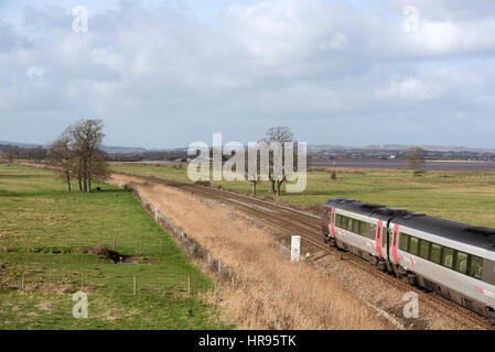 Virgin Trains Firma Personenzug durch englische Landschaft südlich von Exeter in Devon UK Stockfoto