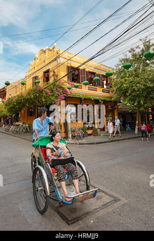 Cyclo in Hoi an eine antike Stadt. Provinz Quang Nam, Vietnam. Stockfoto