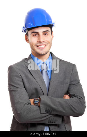 Lächelnde junge Ingenieur isoliert auf weiss Stockfoto