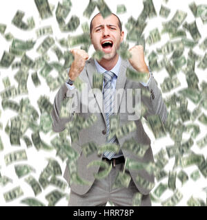 Glücklicher Mann genießen den Regen des Geldes Stockfoto