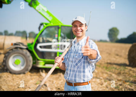 Glücklich Landwirt Daumen aufgeben Stockfoto