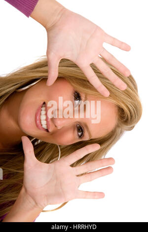 woman framing her face with her hands isolated Stockfoto