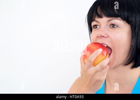 Frau Isst Apfel - isst Frau Apfel Stockfoto