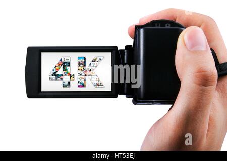 Hand mit Ultra-High-Definition-Camcorder isoliert auf weiss Stockfoto