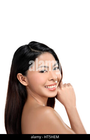 Beautiful asian woman enjoying her black hair and clean skin isolated over white background Stockfoto