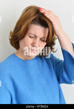 Porträt einer Frau erleben eine Migräne Stockfoto