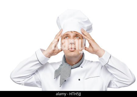 Jungkoch passt seinen Hut auf dem Kopf auf einem weißen Hintergrund Stockfoto