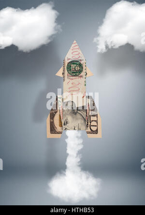 Starten Sie finanzielle Geschäftskonzept, Rakete aus Geld Stockfoto