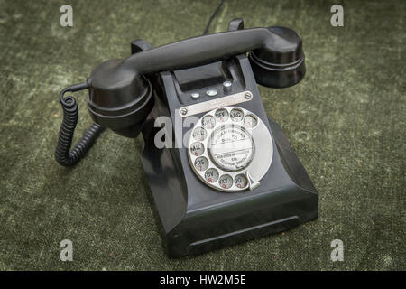 Altmodische Bakelit Art Kunststoff-Telefon Mobilteil mit Wählscheibe. Stockfoto