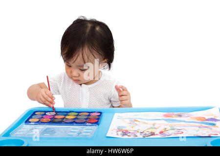 Asiatische kleine Chinesin Malerei mit Aquarell zu Hause Stockfoto