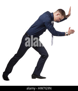 Junge Unternehmer drängen Wand, auf weiß Stockfoto