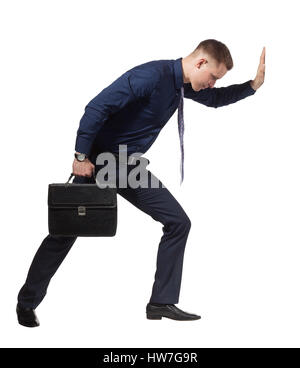 Junge Unternehmer drängen Wand, auf weiß Stockfoto