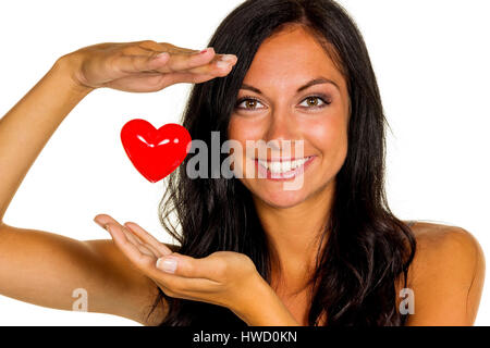 Eine junge Frau in der Liebe hält ein Herz in der Hand, Eine Verliebte Junge Frau H‰lt Ein Herz in der Hand Stockfoto