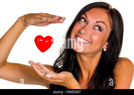 Eine junge Frau in der Liebe hält ein Herz in der Hand, Eine Verliebte Junge Frau H‰lt Ein Herz in der Hand Stockfoto