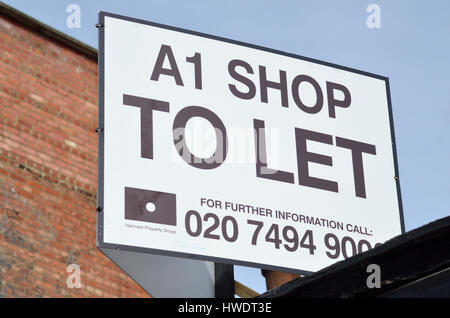 A1 Shop, Immobilienmakler Board zu lassen. Stockfoto