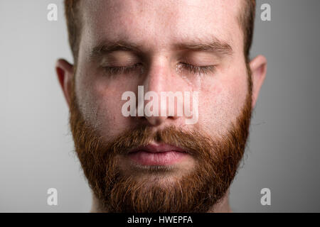 Close Up of a Crying Man with Red Beard Stockfoto