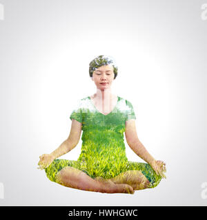 Asiatische schwangere Yoga mit Double Exposure Konzept. Stockfoto