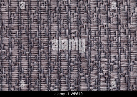 Dunkelgrauen gestrickte wollene Hintergrund mit einem Muster von flauschigen, weichen Tuch. Textur des Braun Textil Closeup. Stockfoto