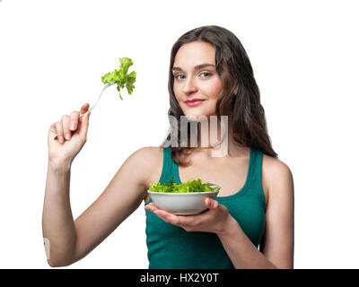 schöne sportliche Frau mit Salat Stockfoto