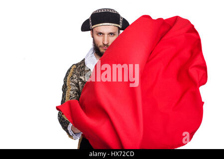 Mann verkleidet als Matador auf weißem Hintergrund. Studio-Porträt Stockfoto