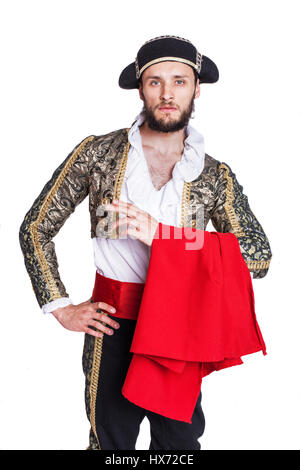 Mann verkleidet als Matador auf weißem Hintergrund. Studio-Porträt Stockfoto