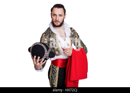 Mann verkleidet als Matador auf weißem Hintergrund. Studio-Porträt Stockfoto