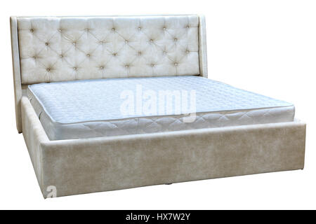 Doppelbett aus Holz mit Creme Kunstleder und orthopädischen Matratzen. Stockfoto