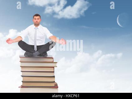 Digitalen Verbund aus Geschäftsmann Meditation sitzen auf Bücher gestapelt von blauen Himmel Stockfoto