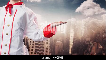 Digitalen Verbund von Koch mit Hand seitlich verschwommen Skyline Stockfoto