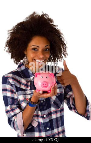 Junge afrikanische Amerikanerin mit Sparschwein - isoliert auf weißem Hintergrund Stockfoto