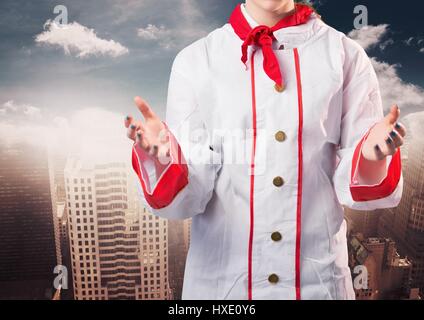 Digitalen Verbund von Koch mit Händen heraus verschwommen Skyline Stockfoto