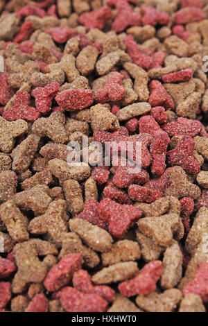 Katzenfutter, Granulat, als Hintergrund. Katze essen Texturmuster. Trockenfutter für Tiere Texturen Studio Foto. Stockfoto