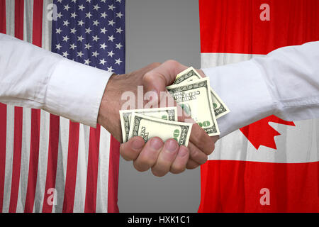 100-Dollar-Rechnungen Handshake mit USA und Kanada-Flaggen-Hintergrund. Stockfoto