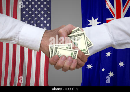 100-Dollar-Rechnungen Handshake mit USA und Australien Flaggen Hintergrund. Stockfoto