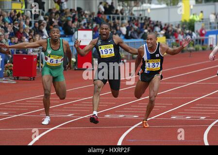 JASON GARDENER gewinnt 100 m 100 m Finale MANCHESTER regionale ARENA MANCHESTER ENGLAND 10. Juli 2004 Stockfoto