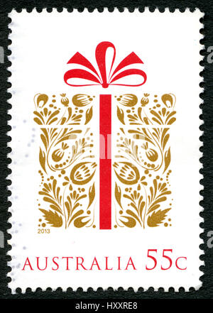 Australien - ca. 2013: Eine gebrauchte Briefmarke aus Australien, Darstellung zur Veranschaulichung der verpackte Weihnachtsgeschenk ca. 2013. Stockfoto