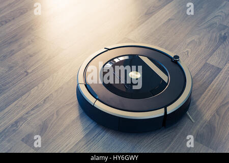 Roboter-Staubsauger auf Holz Laminatboden smart Reinigungstechnik Stockfoto