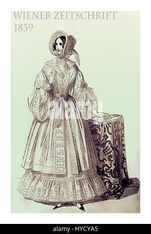 Vienna 1839 Mode; schicke junge Dame gekleidet mit Hut und Haido stehen in Pose im Innenbereich Stockfoto