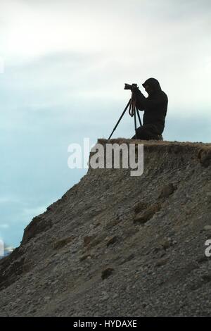 Fotograf mit Stativ Stockfoto