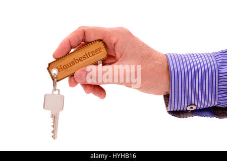 Hausschlüssel in der Hand der Immobilienmakler Stockfoto