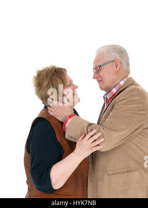 Eine sehr glückliche Senioren paar aussehende Lächeln einander in Liebe, für weißen Hintergrund isoliert. Stockfoto