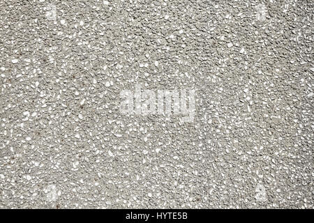 Steinchen in Betonwand, Textur oder Hintergrund. Stockfoto