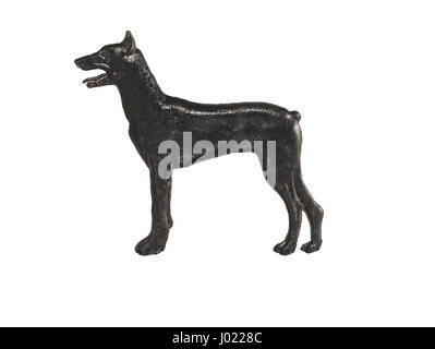 Schwarzer Hund Figur auf weißem Hintergrund, Dobermann Stockfoto