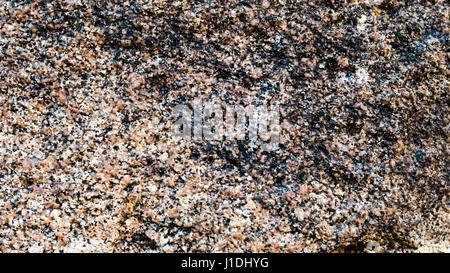 Granittextur, roten Sockel mit schwarzen und grauen Flecken Stockfoto