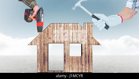 Digital Composite Digital zusammengesetztes Bild der Hände mit Werkzeugen auf Haus Stockfoto