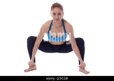 Stretching Pose mit einem professionellen Trainer ausgeführt. Stockfoto