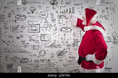 Santa Claus mit Business-Pläne Stockfoto