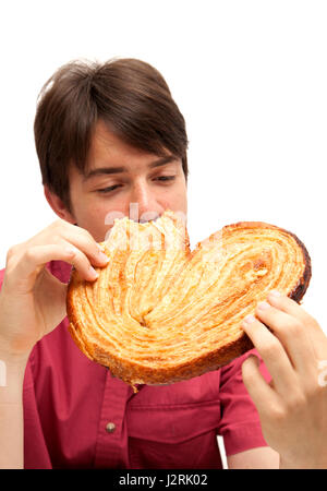 Teenager, Essen, essen riesige Palmerita cookie Stockfoto