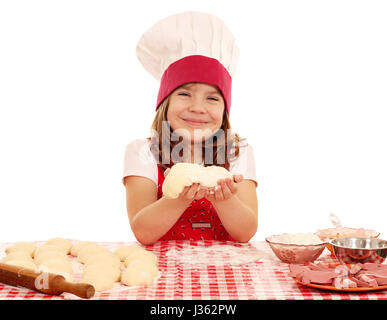 glückliches kleine Mädchen Kochen mit Teig Stockfoto